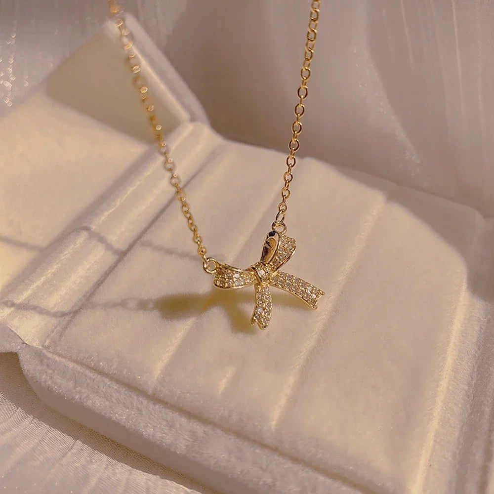 Exquisite Copper Inlaid Zirconia Bow Pendant