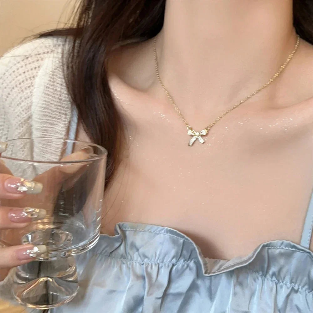 Exquisite Copper Inlaid Zirconia Bow Pendant