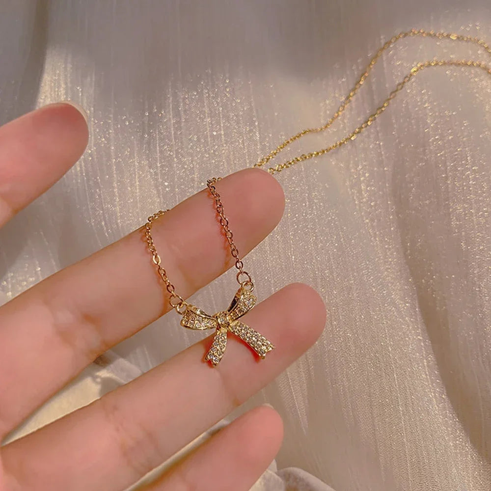 Exquisite Copper Inlaid Zirconia Bow Pendant