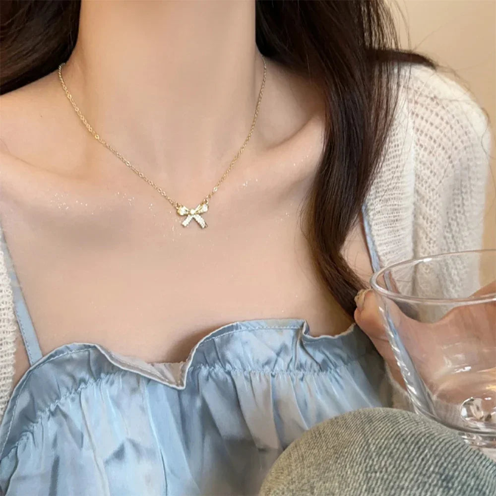 Exquisite Copper Inlaid Zirconia Bow Pendant