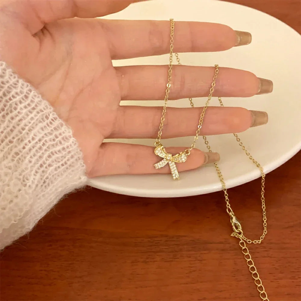 Exquisite Copper Inlaid Zirconia Bow Pendant
